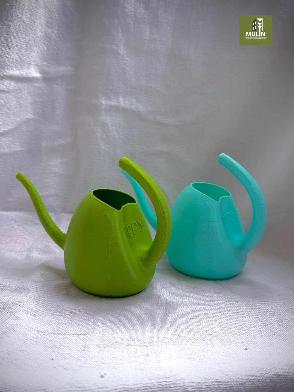 Tippy children’s watering cans in green and turquoise